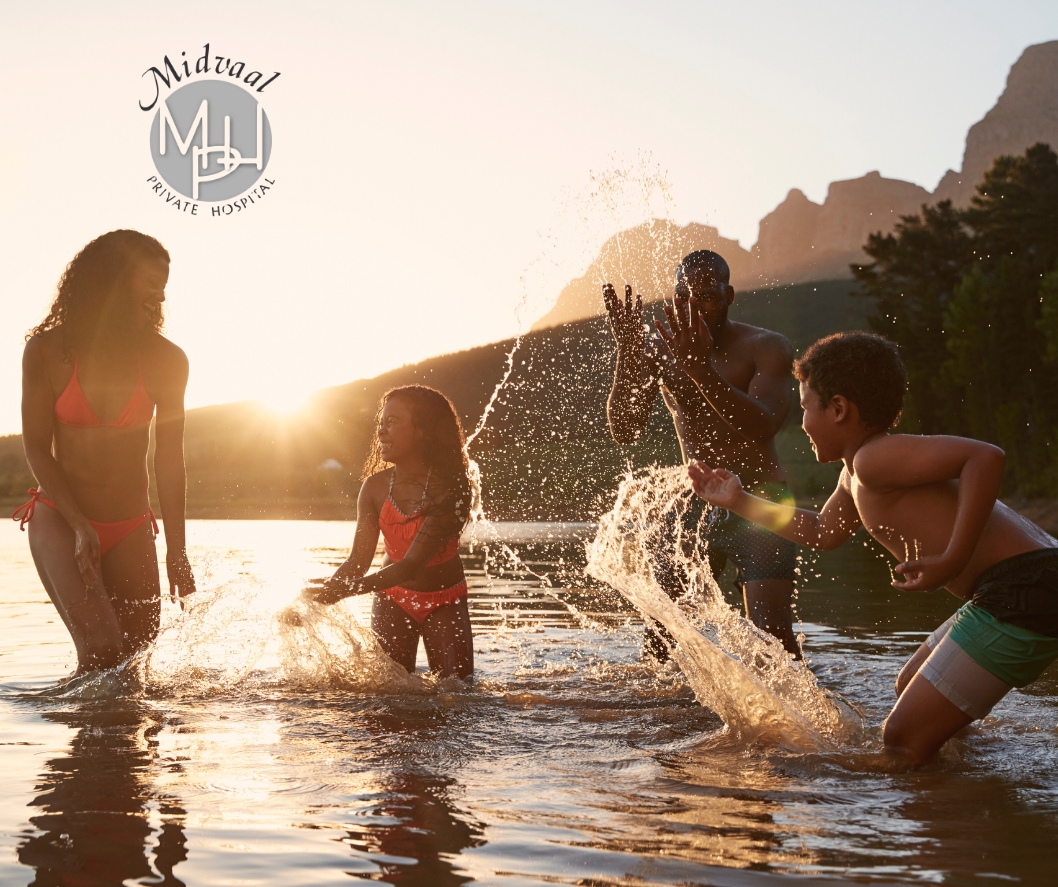 Family enjoying the festive season safely with children playing in a supervised backyard