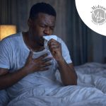 Unwell patient with persistent cough and fatigue, showing potential TB red flags and when to seek medical care