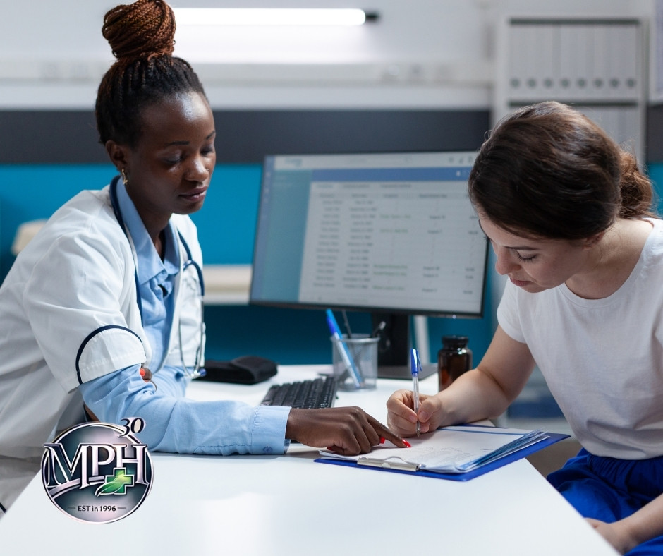 Patient discussing shortness of breath with a doctor during a heart and lung assessment